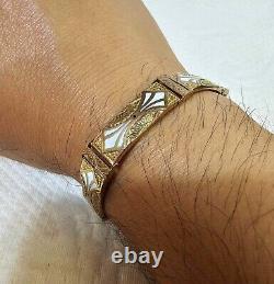 10k gold bracelet with cut flower blue dot white enamel with marked 7.5- 8.56g- B27