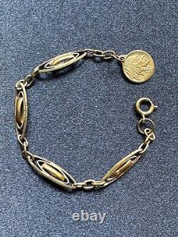 Interesting Gold plated Bracelet with blue enamel residue & an Indian medal