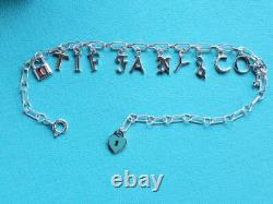 New Tiffany & Co Sterling Silver Blue Enamel Love Notes Logo Charm Bracelet 6.5