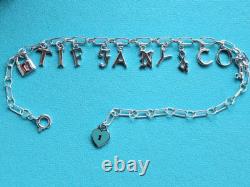 New Tiffany & Co Sterling Silver Blue Enamel Love Notes Logo Charm Bracelet 6.5