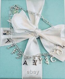 Tiffany & Co Love Notes Dangle Charm Bracelet. Sterling Silver Blue Enamel. New