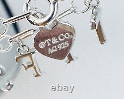 Tiffany & Co Love Notes Dangle Charm Bracelet. Sterling Silver Blue Enamel. New