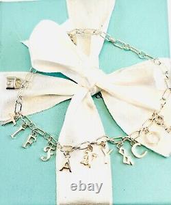 Tiffany & Co Love Notes Dangle Charm Bracelet. Sterling Silver Blue Enamel. New