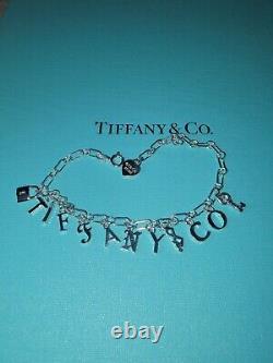 Tiffany & Co Sterling Silver Blue Enamel T&CO Dangle Charm Bracelet MD/LG