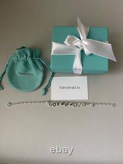 Tiffany Retired Silver Love Notes Charm Bracelet 6.75 New in Box with straw